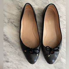 Stuart Weitzman Black Leather Ballet Flats With Bow. Mint Condition, Scuffed In The Front (As Shown In Image). Gold Detail On Bow, Super Comfortable Black Leather Ballet Flats, Stuart Weitzman Shoes, Black Ballet Flats, Leather Ballet Flats, Flat Color, Ballerina Flats, Gold Details, Stuart Weitzman, Mint Condition