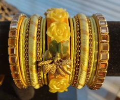 "GUARANTEED TO SHIP NEXT DAY FROM DALLAS, TEXAS - USA Dholki Mehndi Indian Hyderabad Nizami Wedding Bangle 17-Piece Joda Set Kangan with Stones, Ribbon and Flowers. Wedding jewelry, festive colorful bangles. Beautiful radiant color bangles.  Yellow and Golden Bangle Kangan Churi Set Total 17-Piece Size \"2-8\" Yellow & Golden Bangle Set Please see the size guide picture for more information on the size." Gold Embroidered Bracelets For Wedding, Festive Gold Bracelet With Handwork, Festive Handwork Bangle, Festive Gold Bangle With Handwork, Gold Embroidered Bangle Bracelet, Handwork Bracelets For Wedding, Traditional Embroidered Bracelets For Festive Occasions, Embroidered Bracelets For Wedding And Festivals, Gold Bangle With Handwork For Gift