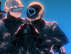 two people dressed in futuristic garb standing next to each other with their hands together