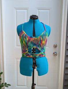 Large handmade crochet top with lace-up back in rainbow. 100% cotton. Sizing (Bust Measurement): XS = 28-30" S = 32-34" M = 36-38" L = 40-42" XL = 44-46" XXL = 48-50" For best care, hand wash or machine wash in delicates bag on a gentle cycle and lay flat to dry. Made from Sneak A Peek pattern (with slight modification for a smaller underbust keyhole) by Kelsie at PassioKnit Goods, passioknitgoods.com. Multicolor Stretch Cotton Crop Top, Hippie Cotton Crochet Top With Lace Details, Hippie Crochet Lace Cotton Top, Hippie Cotton Crochet Lace Top, Hippie Crochet Lace Top In Cotton, Colorful Fitted Tops For Beach, Stretch Multicolor Crochet Top For Summer, Multicolor Stretch Crochet Top For Summer, Summer Multicolor Stretch Crochet Top