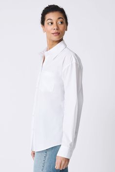 For a playful addition to your wardrobe, our Joni Boyfriend Shirt is the definition of cool tailoring. With a drop shoulder fit, looser body, and the perfect chest pocket, our Miami stripe stretch shirting is your Spring go-to staple. Pair it with your favorite jean or slim bottom. Drop shoulder fit, classic collar construction, center front button opening, chest pocket, classic cuff construction with sleeve placket, back yoke with double back pleat, signature loop detail - 100% Cotton - Fabric White Relaxed Fit Poplin Shirt, Relaxed Fit Poplin Top For Work, White Oversized Poplin Shirt, Oversized White Poplin Shirt, Relaxed Fit Poplin Button-up Top, White Poplin Button-up Shirt, Modern Everyday Shirt With Shirttail Hem, White Poplin Shirt For Work, Modern Shirt With Shirttail Hem For Everyday