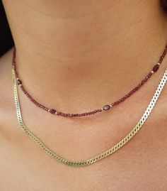 14k solid gold genuine garnet beaded necklace chocker This listing is for 1 necklace with mix of faceted round and oval garnets. Made of 14k solid yellow gold clasp and beads with round and oval garnet beads.   This dainty and minimalist necklace is great alone or stacked with other necklaces *Matching bracelet in my shop:) Measures: ♥️Garnet beads- 2mm round,3x5mm oval ♥️Length- please select in the drop down menu ♥️14k solid gold spring ring clasp Elegant Gemstone Beaded Choker Necklaces, Yellow Gold Garnet Necklaces With Oval Shape, Yellow Gold Oval Garnet Necklace, Fine Jewelry With Faceted Beads For Gifts, Gold Oval Garnet Necklaces, Faceted Oval Ruby Jewelry, Oval Ruby Jewelry With Faceted Detail, Oval Faceted Ruby Jewelry, Oval Garnet Gold Necklace