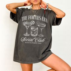 Celebrate your 40s in style with our fun and trendy "The Forties Era" Social Club Cocktail t-shirt! Perfect for a milestone birthday, this trendy tee is designed to capture the spirit of turning 40! DETAILS * Comfort Colors Garment-Dyed Heavyweight T-Shirt * 100% ring spun cotton * Design is printed using DTG technology which uses high-quality water-based inks that are printed directly into the fabric. This means that there may be a slightly faded/vintage look to the design depending on the color and fabric of the garment. SIZING * These unisex T-shirts are true-to-size with a relaxed fit. * Most women find their typical size works best since they are meant to be a bit loose fitting. * Some women size down for a tighter fit. * If you would like a more oversized look, we recommend sizing up Martini Party, Raccoon Shirt, Bar Crawl, Pepper Color, Comfort Colors Tshirt, Outfit Vintage, Dirty Martini, Future Mrs, Retro Humor