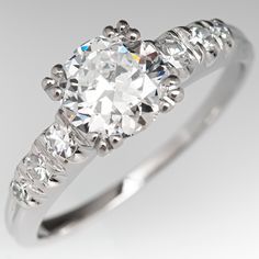 This lovely vintage engagement ring is centered with a round transitional cut diamond weighing 0.72 carat and set into a four-split prong head. The shoulders of the ring are each accented with three (3), prong set, round single cut diamonds. The ring measures 6.0mm at the top, rises 4.3mm above the finger, tapering to 1.1mm wide and 0.9mm thick at the base of the shank. The ring is currently a size 4.25 and we offer complimentary resizing to fit. Classic Round Cut Diamond Ring With Center Stone, Classic Cut Diamond Ring With Center Stone, Classic Gia Certified Diamond Ring For Wedding, Gia Certified Classic Cut Diamond Ring For Wedding, Classic Diamond Ring With Center Stone, Classic Gia Certified Cushion Cut Diamond Ring, Gia Certified Diamond Ring For Wedding, Gia Certified Classic Diamond Ring With Round Stone, Gia Certified Classic Round Diamond Ring