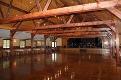 an empty dance hall with wooden floors and ceiling