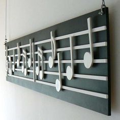 a wall hanging with musical notes on it