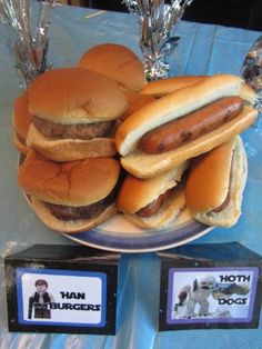 hot dogs and buns are on a plate