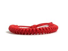 The lucky red slim rope bracelet is a much thinner bracelet than our traditional rope bracelet at about half the size. This is perfect if you're looking for a slimmer, more comfortable, yet stylish look! Adjustable and fits on most wrists up to 9 inches. Designed and handmade by Engineered in California. Usually ships within 1-3 business days. Rope Bracelet, California, Ships, Bracelet, Red