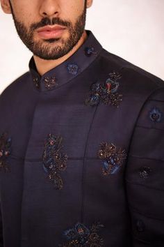 Midnight blue bandhgala with floral motif hand embroidery with pintuck details. Paired with midnight blue kurta and tapered trouser pant.
Component: 3
Pattern: Embroidered
Type Of Work: Floral Motifs
Neckline: Mandarin
Sleeve Type: Straight Full
Fabric: Linen Silk, Lining: Satin
Color: Blue
Other Details: 
Hand embroidery
Pintuck bandhgala
Occasion: Sangeet - Aza Fashions Designer Embroidered Blue Bandhgala, Elegant Blue Embroidered Bandhgala, Festive Blue Bandhgala With Intricate Embroidery, Festive Blue Bandhgala With Cutdana Details, Semi-formal Embroidered Blue Bandhgala, Satin Color, Pin Tucks, Trouser Pants, Embroidered Silk