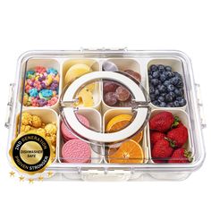 a plastic container filled with lots of different types of fruit and snacks on top of each other