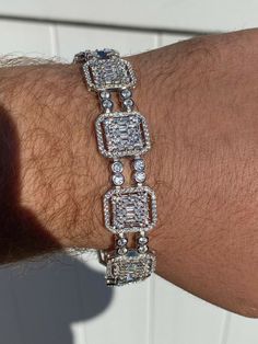 Men's 8.5" long 16mm wide bracelet
***Also available in size 7.5" please leave a message at the CHECKOUT screen where it says "Message to Seller". if you want the 7.5", otherwise we ship 8.5" by default ***
 
Heavy 39 grams.
 
20ct man made diamonds
Gorgeous baguette & round stones 
You can’t tell difference from natural diamonds without a microscope 
Super ICY you have to see to believe!!
 
Solid 925 silver
Not plated or filled...this i Silver Diamond Bracelet With Baguette Diamonds, Rectangular Baguette Diamond Bracelets For Anniversary, Classic Silver Tennis Bracelet, Silver Rectangular Tennis Bracelet With Jubilee Design, Silver Rectangular Tennis Bracelet With Jubilee Style, Rectangular Silver Jewelry With Baguette Diamonds, Silver Rectangular Diamond Bracelet With 17 Jewels, Silver Rectangular Jewelry With Baguette Diamonds, Silver Rectangular Tennis Bracelet For Formal Occasions