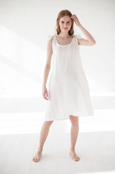 "READY TO SHIP Summer Linen Dress, Slip Woman Dress, Midi Linen Dress DETAILS * Adjustable slip dress for your comfort * Open back gives femininity * Stylish accent - buttons on the back * Made from soft wash medium weight (185 g) 100 % European linen fabric * Height of the model is 177 cm (5' 8\") and she is wearing size XS/S dress in ivory color * The length of linen dress laying down on the floor is +/- 141 cm / 55.51.6\" (ties included in the length), ties length from the neckline is +/- 54 Summer Knee-length Sleep Dress, Midi Linen Dress, Summer Linen Dresses, Tie Length, Dress Slip, Woman Dress, Summer Linen, European Linens, Dress Midi