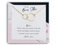 a card with two gold rings on it and the words, to my boring sister