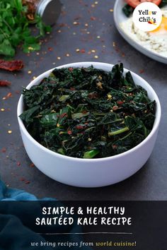 a white bowl filled with cooked kale and rice on top of a black table