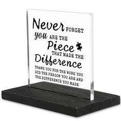 a glass plaque with the words never forget you are the piece that made the difference