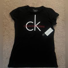 Brand New With Tags Still Intact. Calvin Klein Graphic Tee For Streetwear, Fitted Trendy Calvin Klein Tops, Trendy Fitted Calvin Klein Tops, Calvin Klein Graphic T-shirt For Streetwear, Fitted Calvin Klein Casual T-shirt, Calvin Klein Graphic Crew Neck T-shirt, Calvin Klein Crew Neck Graphic T-shirt, Calvin Klein Graphic Print Crew Neck T-shirt, Calvin Klein Short Sleeve Graphic T-shirt