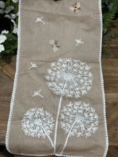 a table runner with dandelions on it