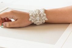 Crystal Wedding Bracelet for Bride, Beaded cuff for the bride, Silver and white bridal bracelet , Style- BA02Finished with ivory tulle fabricThe length of the tulle fabric is more than what you would normally need. This would allow you to tie the tulle to your linking and cut out the additional tulle fabric.Length = 5 to 5.5Width = 2.2 to 2.5 inchesOver all color = Silver and white beadsThese are approximate measurementsShipping :-  Please allow 4 to 6 weeks to complete workShop Policy : All ite Crystal Wedding Bracelet, Bracelet For Bride, Bridal Cuff Bracelet, Beaded Pillow, Rose Gold Bridal, Beautiful Belts, Swarovski Stones, Adjustable Jewelry, Wedding Belts