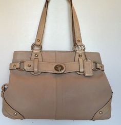 Coach 13236 Handbag Carly color Ivory genuine leather handles Belt- like detail around bag On sides dog leash clasp detail Silver hardware genuine leather handbag One interior zippered pocket Two interior cellphone multifunction pocket preowned very good condition smoke-free Come with dust bag Designer Beige Satchel With Branded Hardware, Vintage Beige Shoulder Bag With Branded Hardware, Vintage Shoulder Bag With Silver-tone Hardware And Double Handle, Vintage Double Handle Shoulder Bag With Silver-tone Hardware, Vintage Bag With Branded Hardware And Double Handle, Classic Beige Bag With Silver-tone Hardware, Classic Beige Satchel With Gold-tone Hardware, Cream Shoulder Bag With Branded Hardware And Double Handle, Beige Double Handle Satchel With Branded Hardware