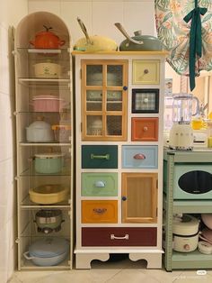 an assortment of kitchen items on display in a room