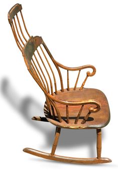 a wooden rocking chair with an arm rest and foot rests on the ground, against a white background