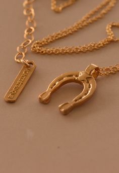 ” The combination of luck and magic, captured by this symbol is believed to bring good luck and fortune in people’s lives.” Handcrafted etched horseshoe pendant. 14K gold-filled chain/bronze pendant, sterling silver chain/fine silver pendant Standard Adjustable 16” + 2” Handcrafted in Los Angeles Lucky Charm Necklace, Horseshoe Pendant, Dragonfly Charm, Gold Charm Necklace, Bronze Pendant, Initial Pendant, Single Earring, Lucky Charm, Gold Filled Chain