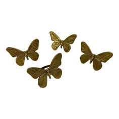 three gold butterflies are shown on a white background and one is in the shape of a butterfly