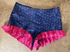 "Sizes S,M,L ruffle hot pants with center back zipper. These are short shorts.   medium measurements: 32\" waist 36\" high hip 40\" low hip   navy/fuchsia: recycled synthetic fiber, Nylon or polyester  light blue with white stripes: recycled natural fibers, cotton or linen  These are made to order too so you can choose what fabric based on color but these or mostly floral. Some have contrasting ruffles. Open to working on the design together!" Fitted Short Bloomers For Summer, Fitted Short Summer Bloomers, Blue High-waist Shorts With Ruffles, High Waist Blue Shorts With Ruffles, Fitted Short Bottoms With Ruffles, Summer Fitted Bloomers With Elastic Waistband, Blue Ruffled Short Bottoms, Fitted Summer Bloomers With Elastic Waistband, Blue Ruffled Bloomers For Summer