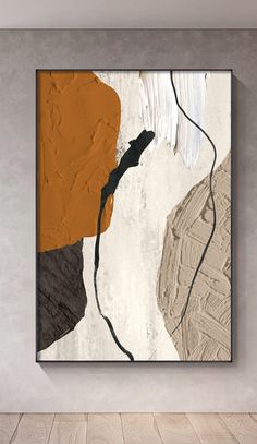 an abstract painting hangs on the wall