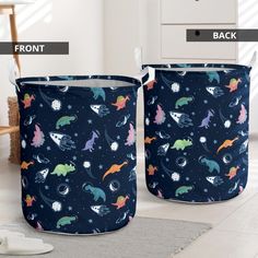 two storage bins with dinosaurs and stars on them