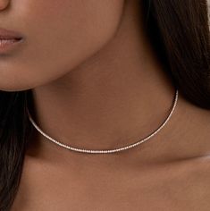 Elevate your elegance with this stunning luxury diamond tennis necklace. Crafted in 14K/18K white gold, it features 3.50 carats or 6 carats of shimmering, lab-grown diamonds, arranged in a timeless choker design. Perfect as a statement piece or for layering, this necklace is ideal for special occasions or an anniversary present for her. Experience sustainable luxury with unmatched sparkle. Indulge in brilliance with Evara Jewelry’s finest. 𝐅𝐞𝐚𝐭𝐮𝐫𝐞𝐬:• 𝐌𝐚𝐝𝐞 𝐭𝐨 𝐎𝐫𝐝𝐞𝐫• 𝐌𝐞𝐭𝐚𝐥: Choker Design, Elegant Choker, Stacked Wedding Rings, Choker Designs, Diamond Tennis Necklace, Diamond Choker, Luxury Diamonds, Tennis Necklace, Engagement Rings Oval