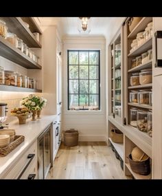 a kitchen filled with lots of open shelves