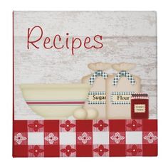 a red and white checkered table cloth with an image of two breads on it