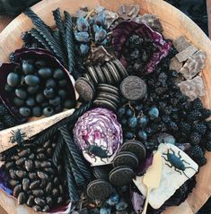 a wooden bowl filled with different types of food