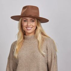 Aspen | Womens Wide Brim Felt Fedora Hat offers bold, rustic style with its Australian wool felt and unique leather band trim. Perfect for outdoor adventures with its 3 1/2" brim and distinctive brass and matchstick details. Material: Midweight 100% Australian Wool Felt Shape: Outback Trim: Leather Band Latch with Hemp Rope, Brass Safety Pin, and Matchstick Brim Size: 3 1/2" Crown hHeight: 4" Sweatband: AHM Velcro Imported Rustic Short Brim Felt Hat For Fall, Rustic Adjustable Hats For Fall, Rustic Felt Hat With Short Brim For Fall, Rustic Brimmed Felt Hat For Fall, Rustic Fedora With Flat Brim For Fall, Rustic Winter Fedora With Curved Brim, Rustic Curved Brim Hat For Fall, Rustic Outdoor Hats For Fall, Rustic Fall Hat With Curved Brim