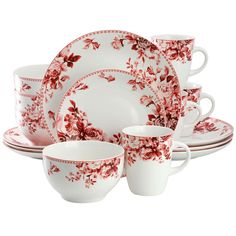 a red and white dinnerware set with flowers on the plates, cups and saucers