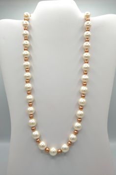 This is a beautiful white glass pearl & gold colored glass beads. Length is 22inches with a 1inch extender and a gold stainless steel lobster clasp. Rose Gold Beaded Pearl Necklaces, Gold Pearl Necklace With Large Beads, Gold Pearl Beaded Necklaces With Large Beads, Adjustable White Pearl Necklace With Gold Beads, Gold Pearl Necklaces With Large Beads, Gold Pearl Beaded Necklace With Large Beads, Large Gold Pearl Beads, White Pearl Necklaces With 8mm Beads, Rose Gold Pearl Necklace With Round Beads