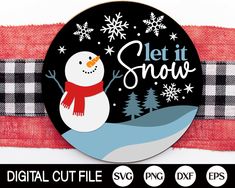 a snowman is standing on top of a red and black checkered scarf with the words let it snow