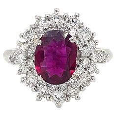 an oval shaped ruby and diamond ring