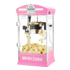 a pink popcorn machine is shown with measurements