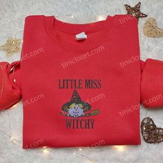 Introducing our Little Miss Witchy Embroidered T-shirt, a bewitchingly adorable addition to your wardrobe this Halloween! Made with premium quality fabric, this shirt features an enchanting embroidered design of a mischievous witch, adding a touch of spooky charm to your outfit. With its comfortable fit and soft texture, it ensures all-day comfort while making a stylish statement. Perfect for Halloween parties or casual wear, this t-shirt showcases your love for all things magical. Unleash your Halloween Gift Ideas, Peanuts T Shirts, Best Family Gifts, Snoopy Halloween, T Shirt Picture, Cute Sweatshirts, Embroidered Sweatshirt, Halloween Fashion, Halloween Sweatshirt