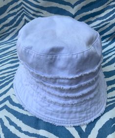 "Part of my personal collection, you will love the fact that this cute stylish hat can be rolled up to go with you in your purse or beach bag.   My hair color different now so passing it on.  White Summer white, 100% Cotton. Wanting it to be completely clean, I put in washer with free clear laundry pods. I dissolve them first but apparently did not soak them long enough, as they made spots in inside blue lining. It was perfect when I put hat in.  So annoying, those things have faded socks etc. Crystal Coasters, Laundry Pods, So Annoying, Bucket Hat White, White Fringe, Vintage Memory, Summer White, Stylish Hats, Black Stains