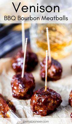 bbq bourbon meatballs with toothpicks in them