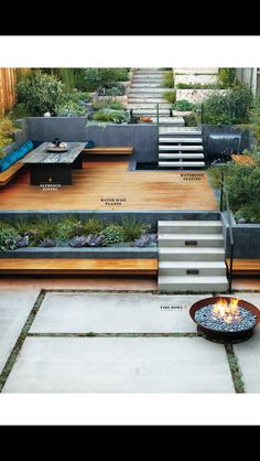 an outdoor fire pit in the middle of a yard