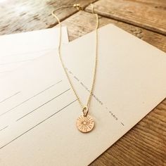 New! Radiant beams of light grace this small round charm and remind us to shine brightly, wherever we go. Down Arrow Icon, Beams Of Light, Light Necklace, Message Necklace, Be The Light, Travel Light, Chain Earrings, To Shine, Live Light