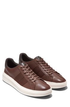 This sporty and stylish sneaker is a comfortable footwear staple you'll want to wear with every outfit. Cushioned insole White sole Leather upper/textile and leather lining/rubber sole Imported Brown Cushioned Sneakers For Light Sports, Brown Low-top Sneakers With Ortholite Insole, Comfortable Brown Sneakers With Cushioned Footbed, Comfortable Brown Sneakers With Ortholite Insole, Brown Textile Sneakers With Contrast Sole, Comfortable Brown Sneakers With Textured Sole, Urban Brown Synthetic Sneakers, Brown Textile Sneakers With Rubber Sole, Brown Sneakers With Branded Insole