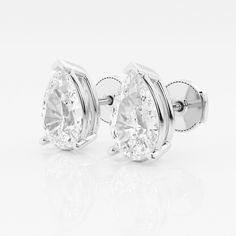 pair of diamond earrings on white background