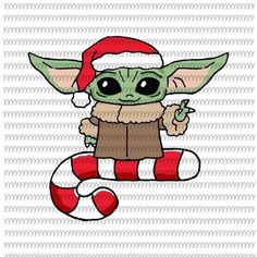 the baby yoda is holding a candy cane