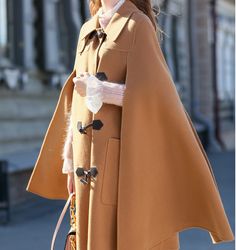 Product Description: handmade Cashmere coat high grade fabric,cashmere fabric.also could be custom made with any size and other colors,please feel free to contact with me if you want custom it. Material: cashmere 100% Size: S: Bust : 102 cm shoulder and Sleeve:70cm Length:105cm M: Bust : 106 cm shoulder and Sleeve:71cm Length:105cm L: Bust : 112cm shoulder and Sleeve:72cm Length:105cm XL: Bust : 116cm shoulder and Sleeve:73cm Length:105cm Shipping we ship worldwide the USPS takes about 15 days a Luxury Single-breasted Wool Coat For Winter, Luxury Wool Long Sleeve Cape, Luxury Elegant A-line Wool Coat, Women Wool Coat, Wool Cloak, Elegant Brown Single-breasted Wool Coat, Luxury Brown Full-length Outerwear, Cashmere Fabric, Cashmere Coat