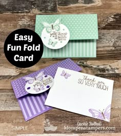 three cards with the words easy fun fold card on them, and two envelopes